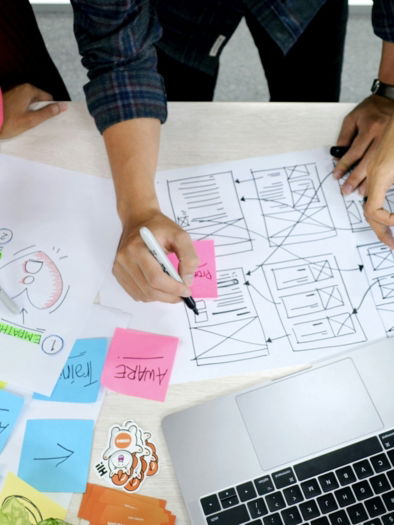 person writing on white paper